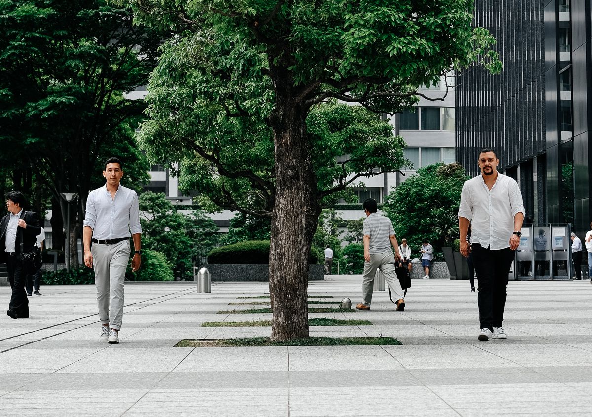 Maxim Oltyan and Davron Talipov, founders of SAD, by the colonnade of a building