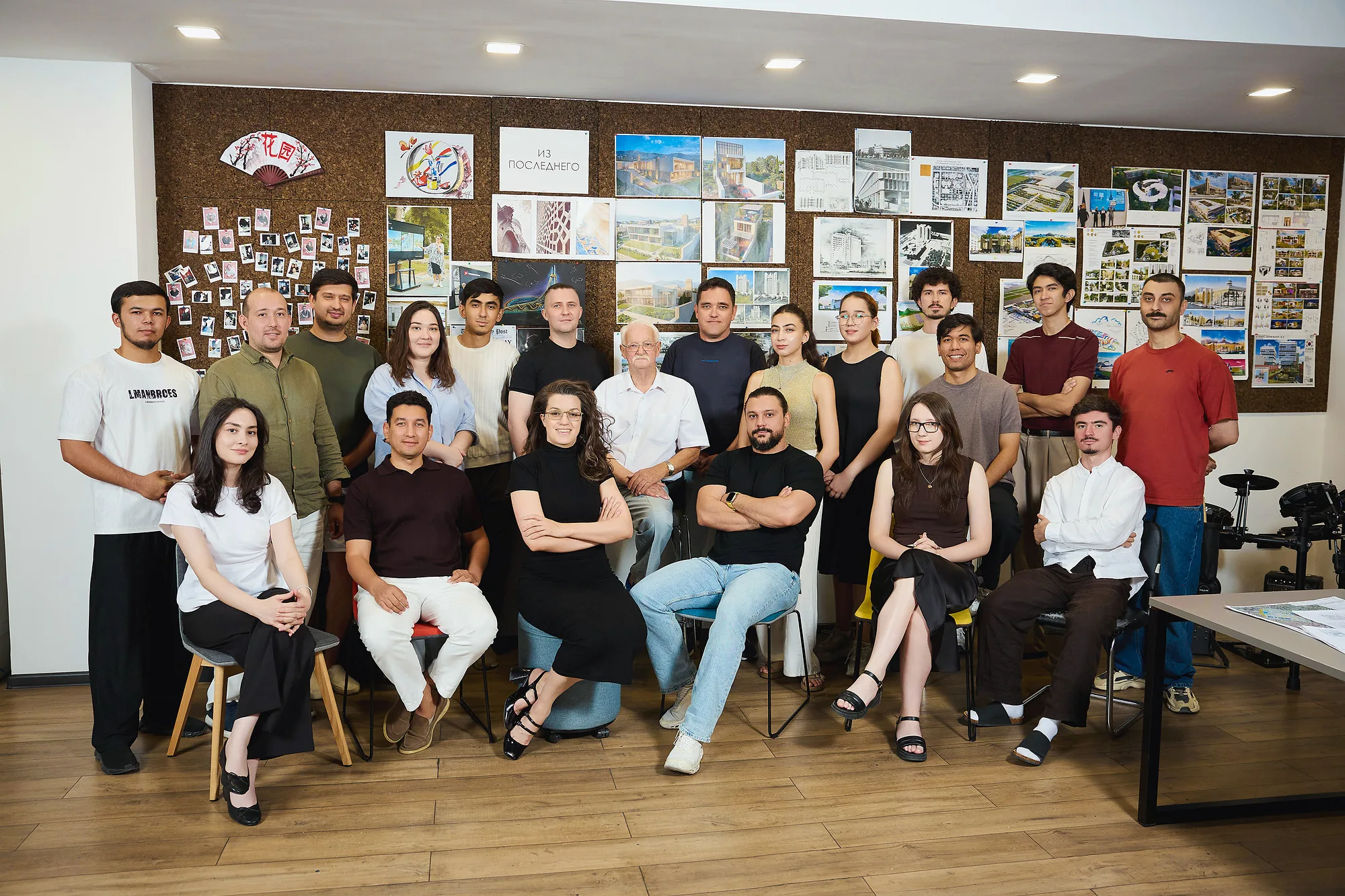 The SAD team in the Tashkent office: twenty architects, engineers and designers in front of the studio project wall