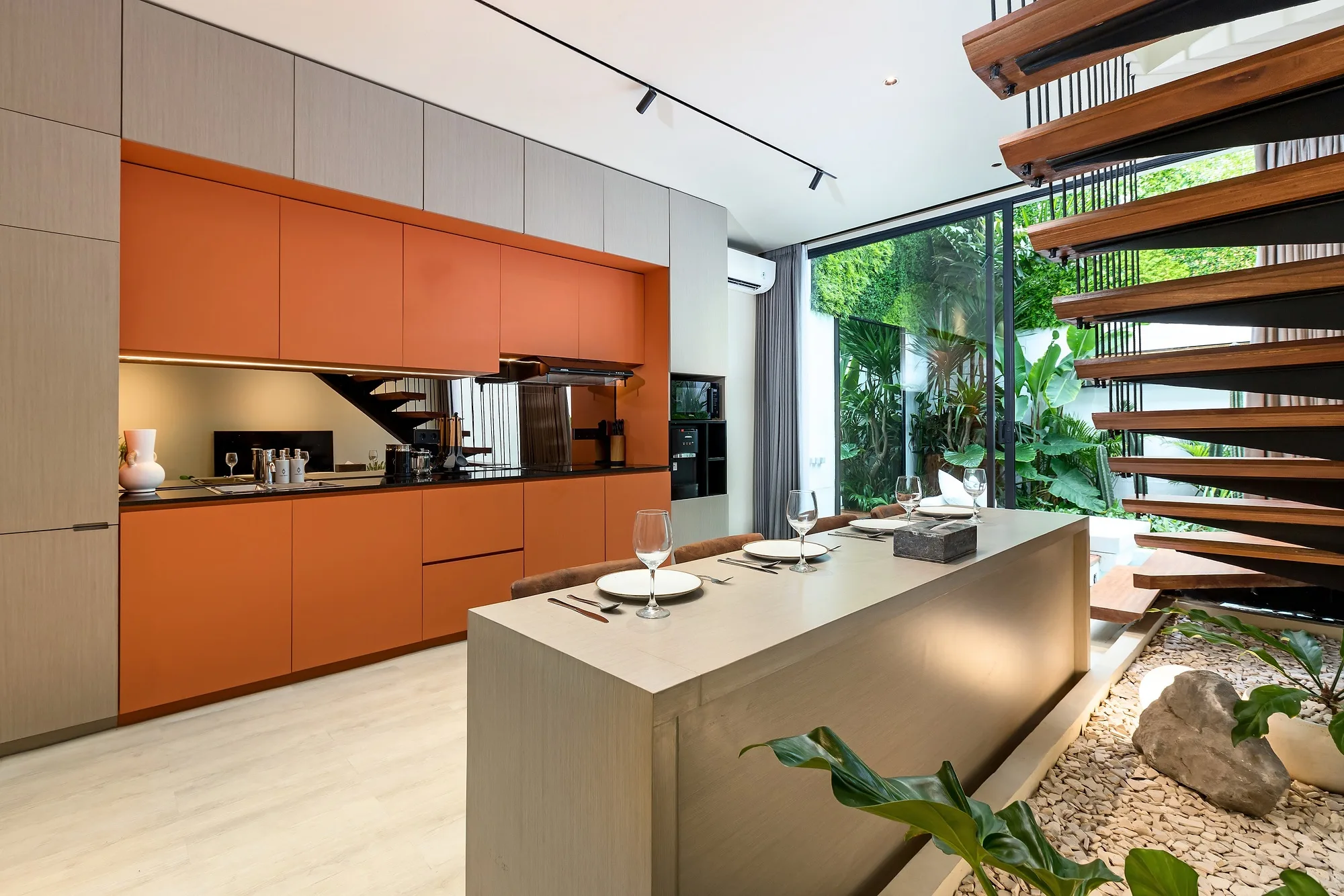 Villa kitchen and dining with the open stair to the upper level