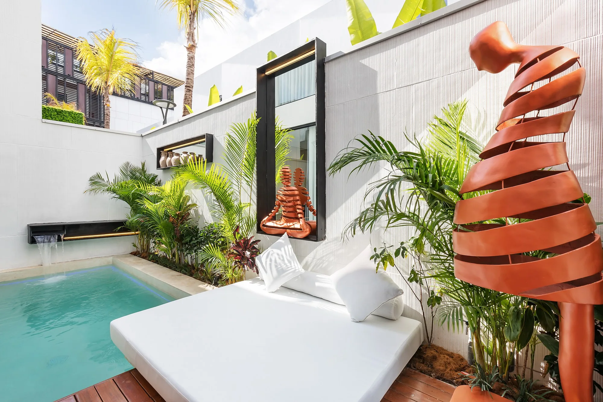 A courtyard with its pool and timber deck