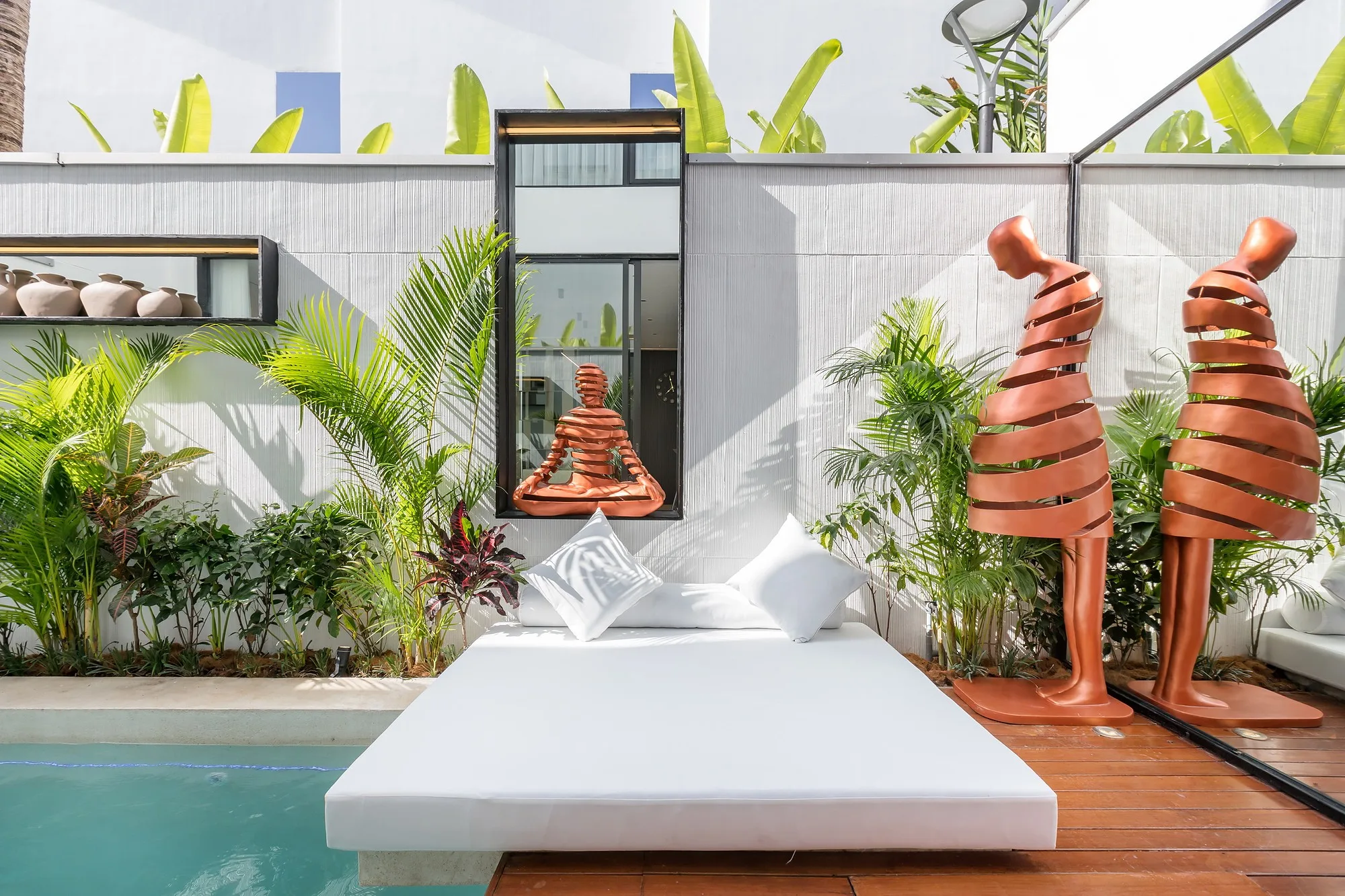 A courtyard with seating by the water