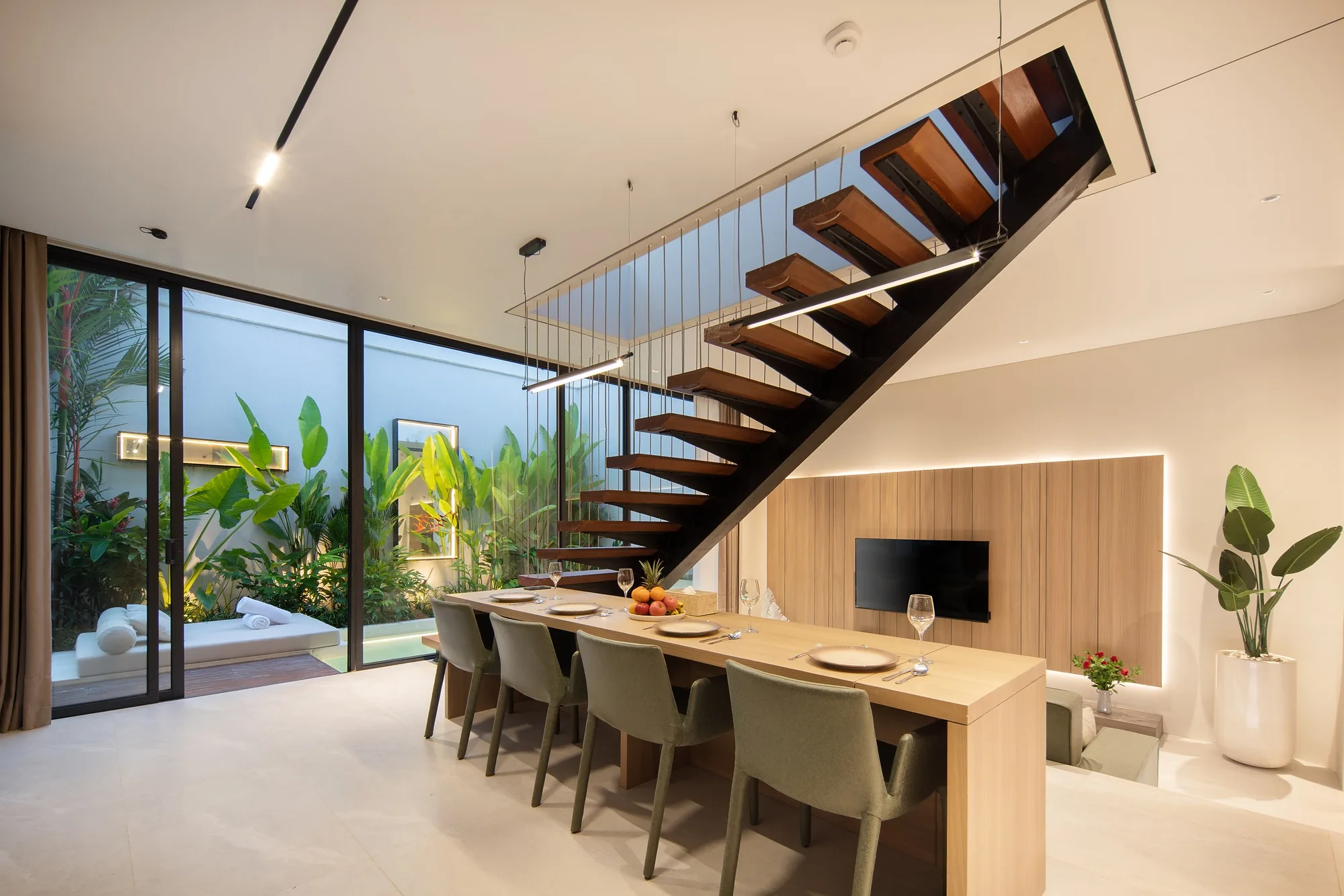 The dining area and stair within the double-height living volume