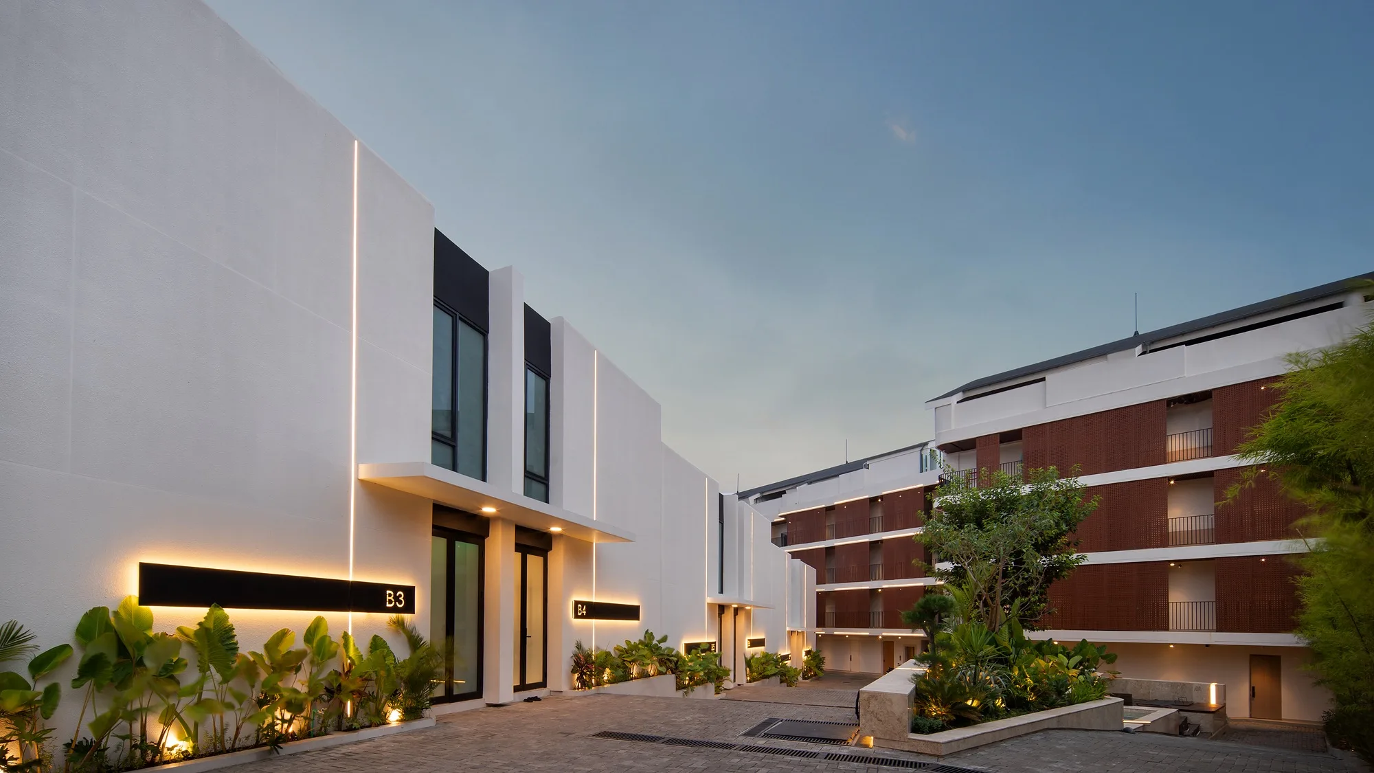 Alex Villas 6 in Bali: a villa and apartment complex, the internal street at dusk