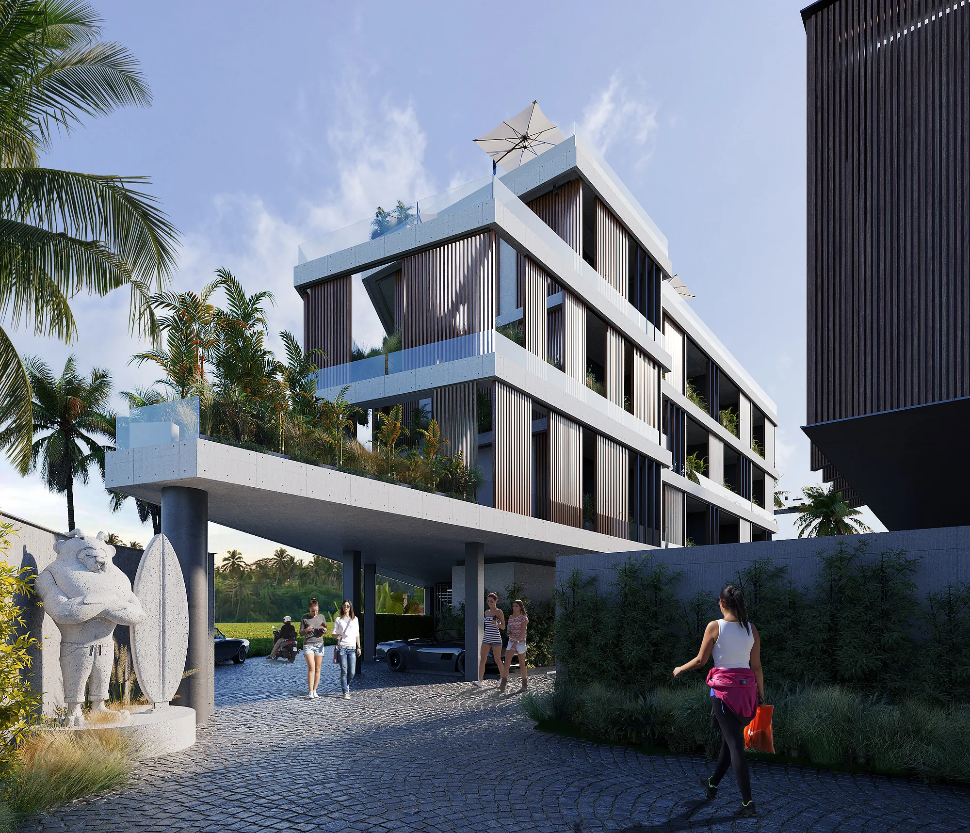 Entrance drive to Alex Villas 8 in Bali: the canopy over the drive, a sculpture by the entrance and paved road — SAD studio