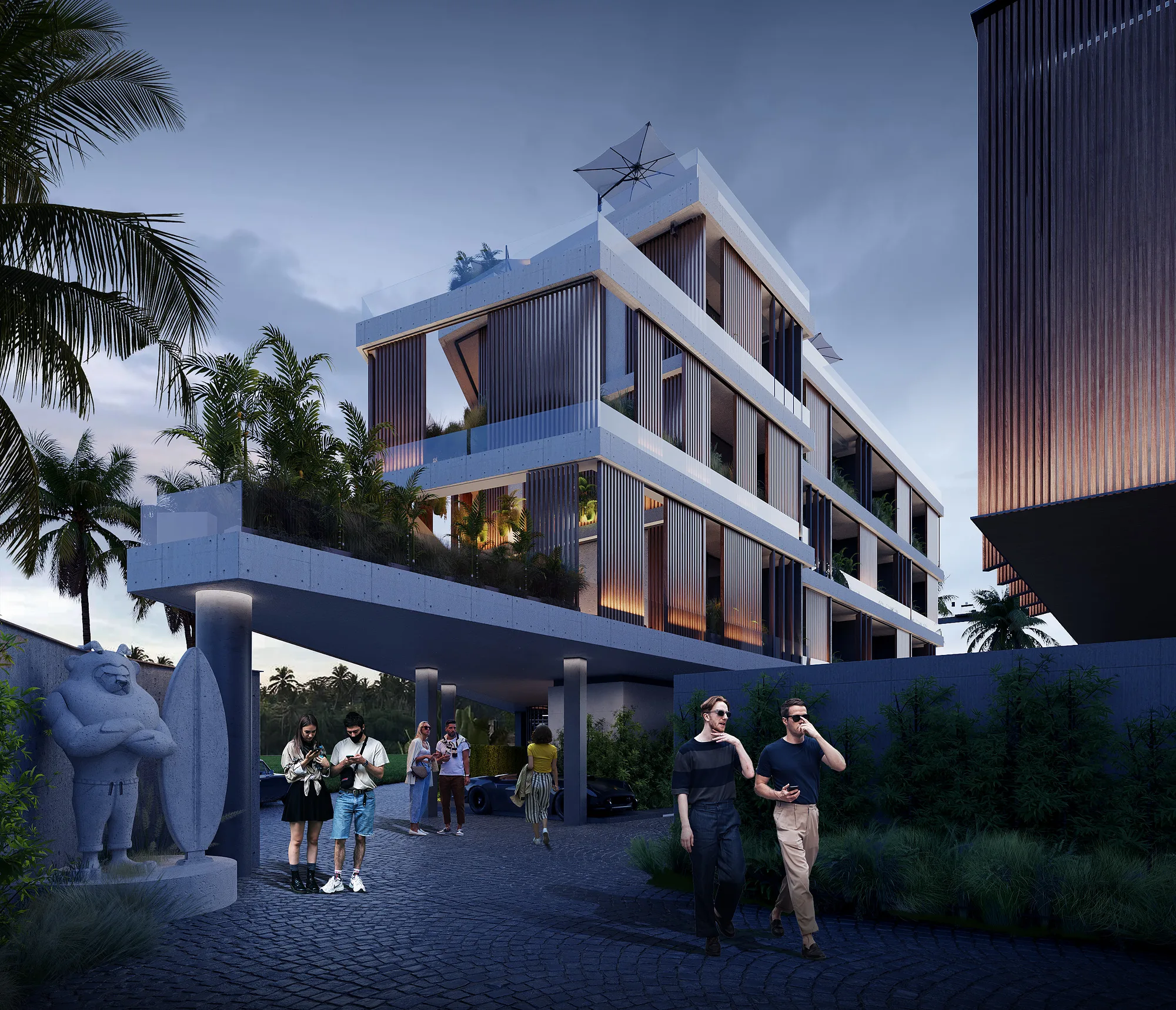 Alex Villas 8 in Bali at dusk: the lit entrance level and the upper apartment terraces — SAD studio