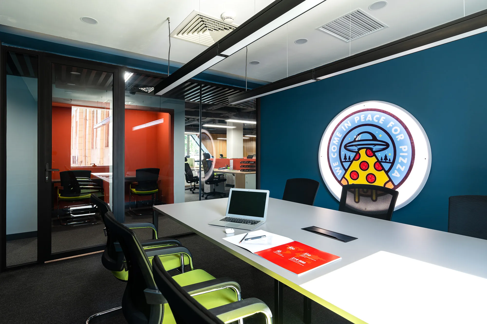 Photo of the meeting room with the company logo on the wall