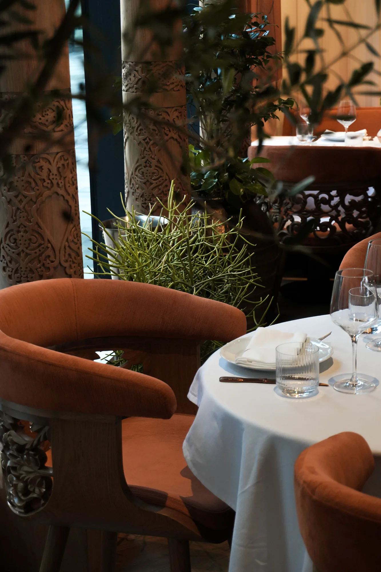 Photo of armchairs and a laid table