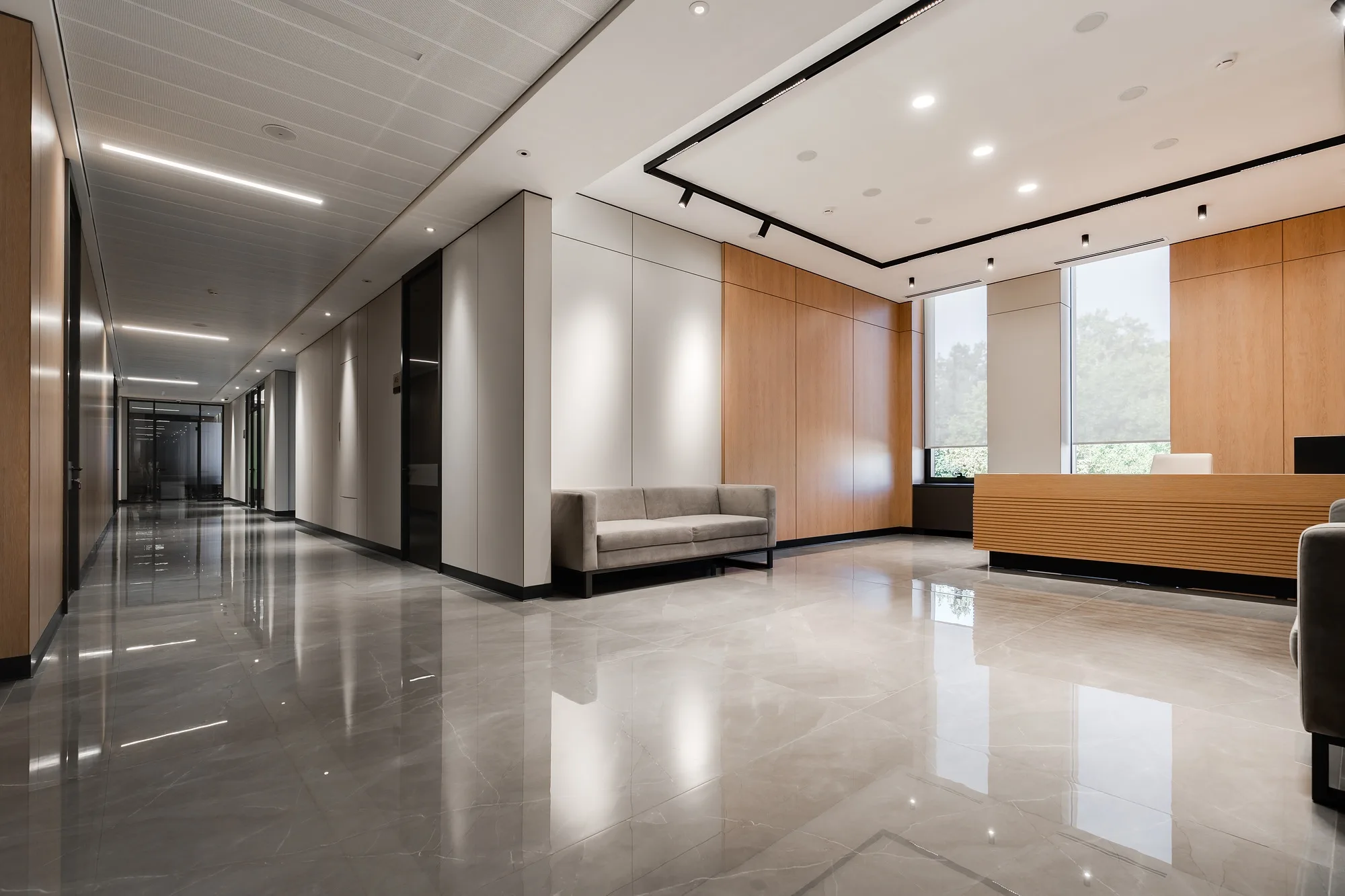Lift lobby of the Tashkent business centre with polished stone floor, SAD architecture studio