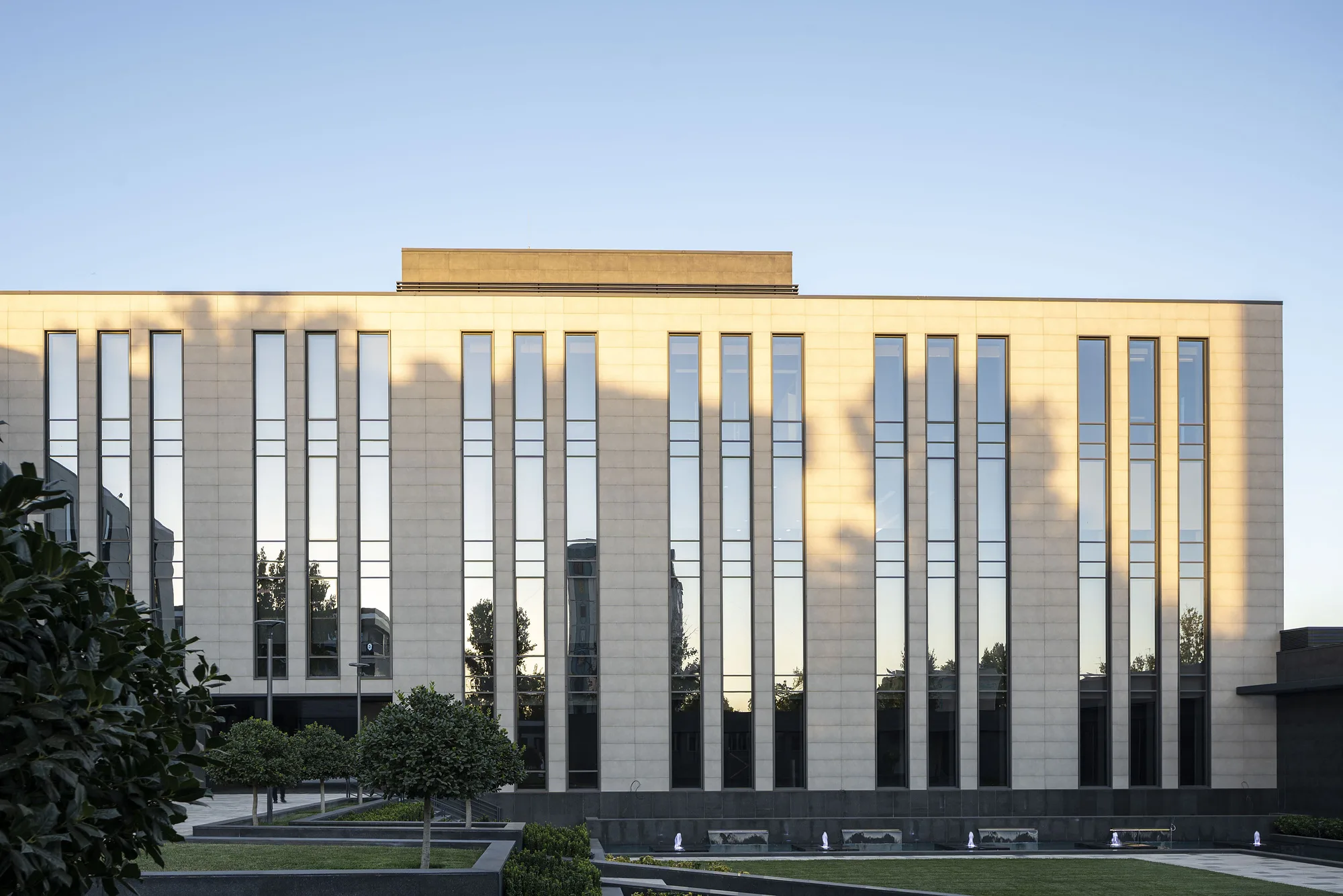 Facade of the business centre on Chust street in Tashkent: pale stone and narrow vertical windows