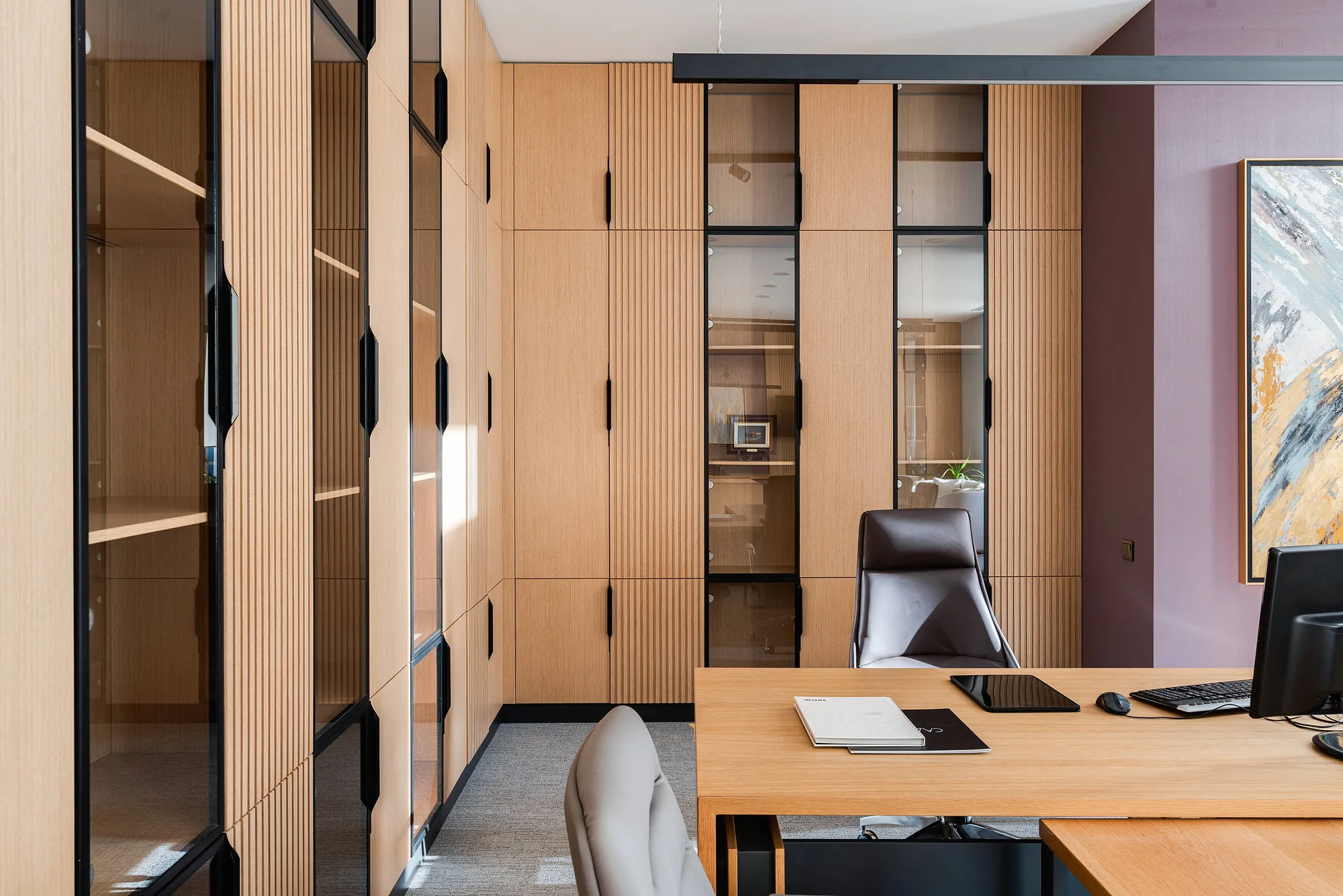 Office room with timber panelling and lit niches