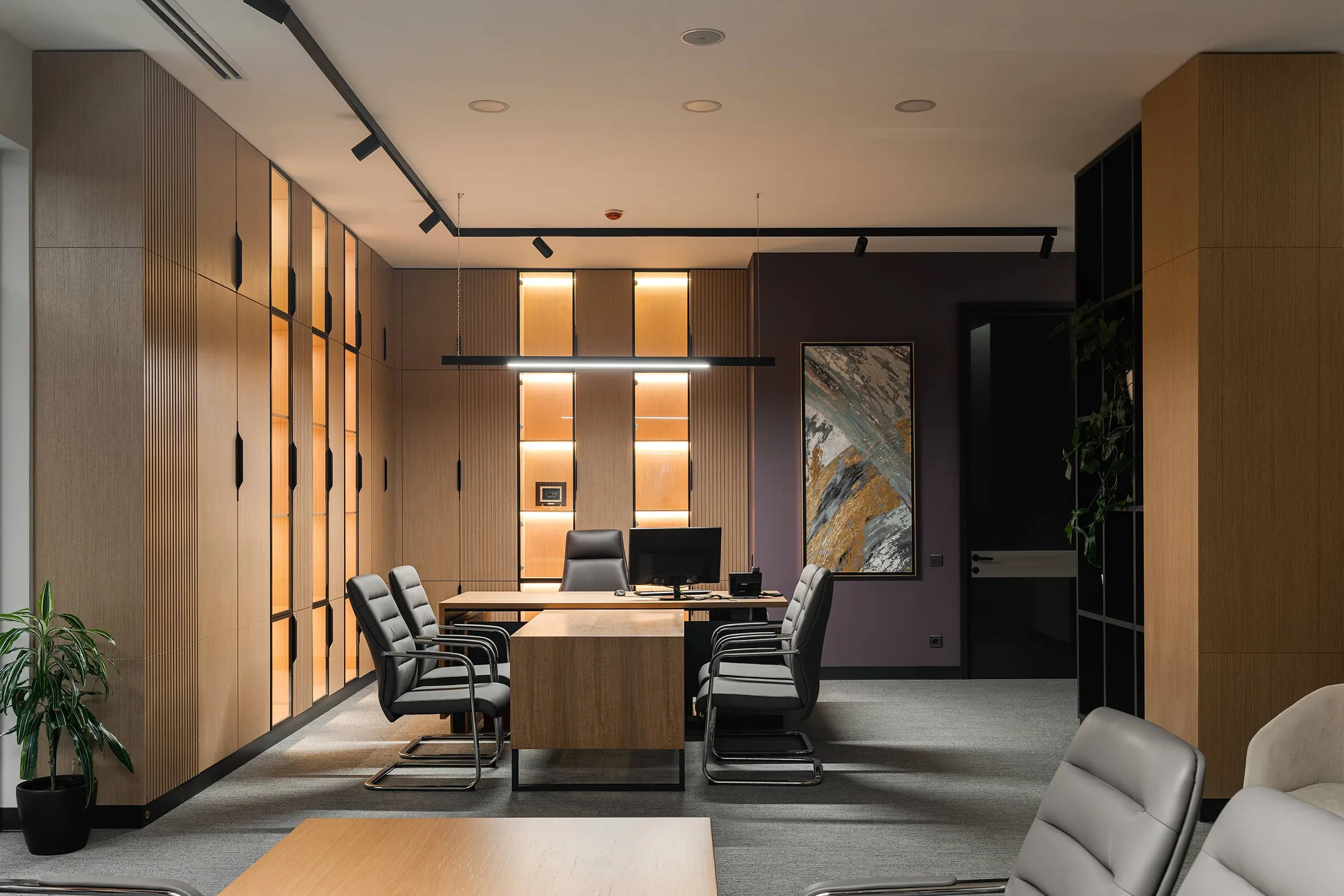Meeting area with timber panelling and plants