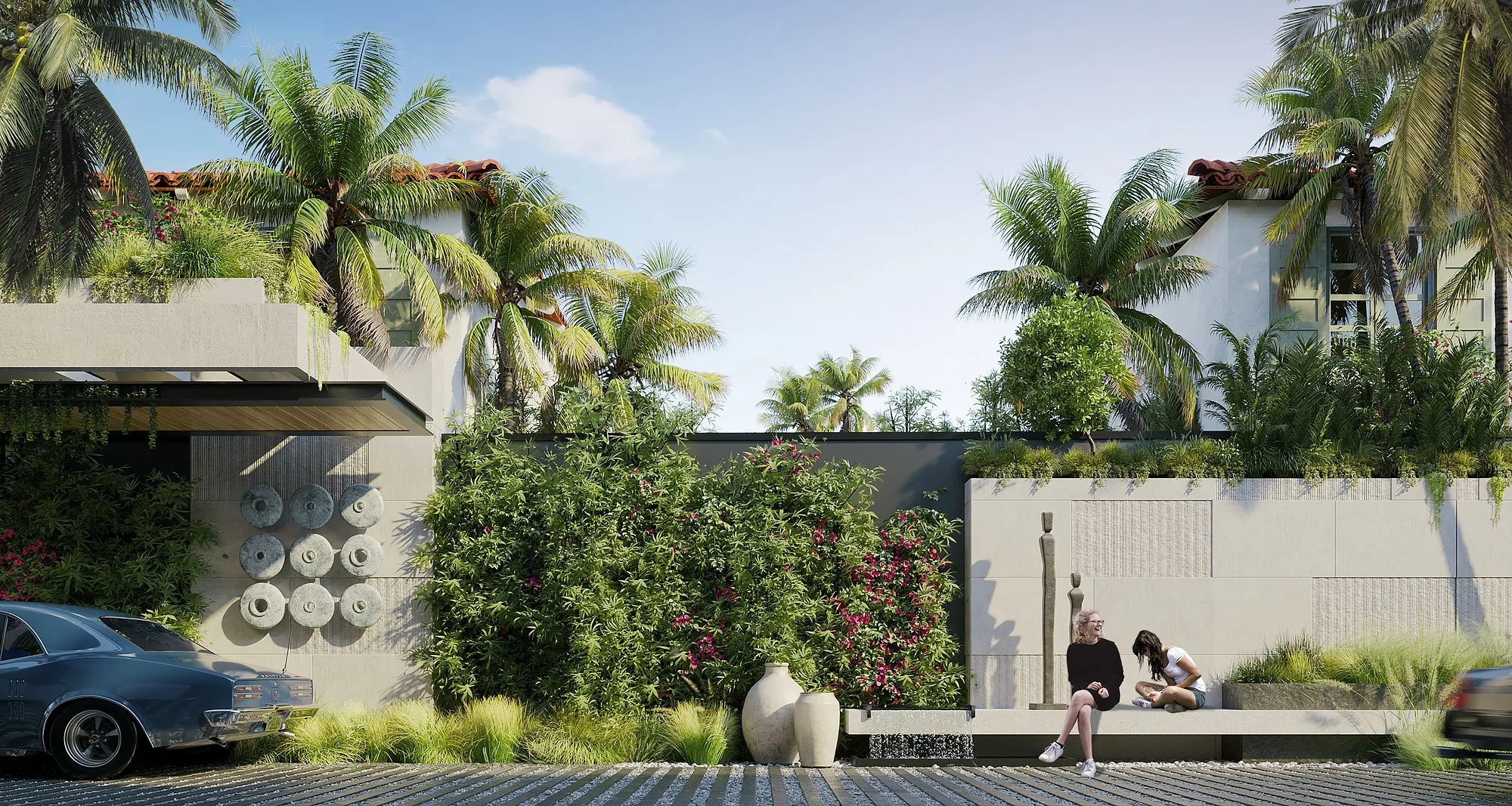 The entrance zone of the complex with a stone wall and planting