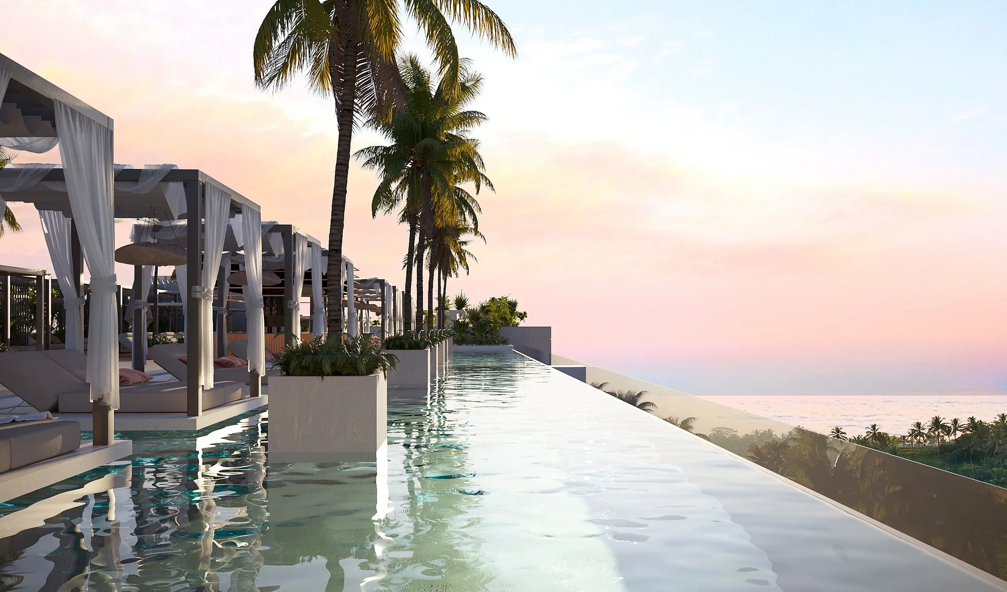 The infinity pool on the roof at sunset, looking out to the ocean