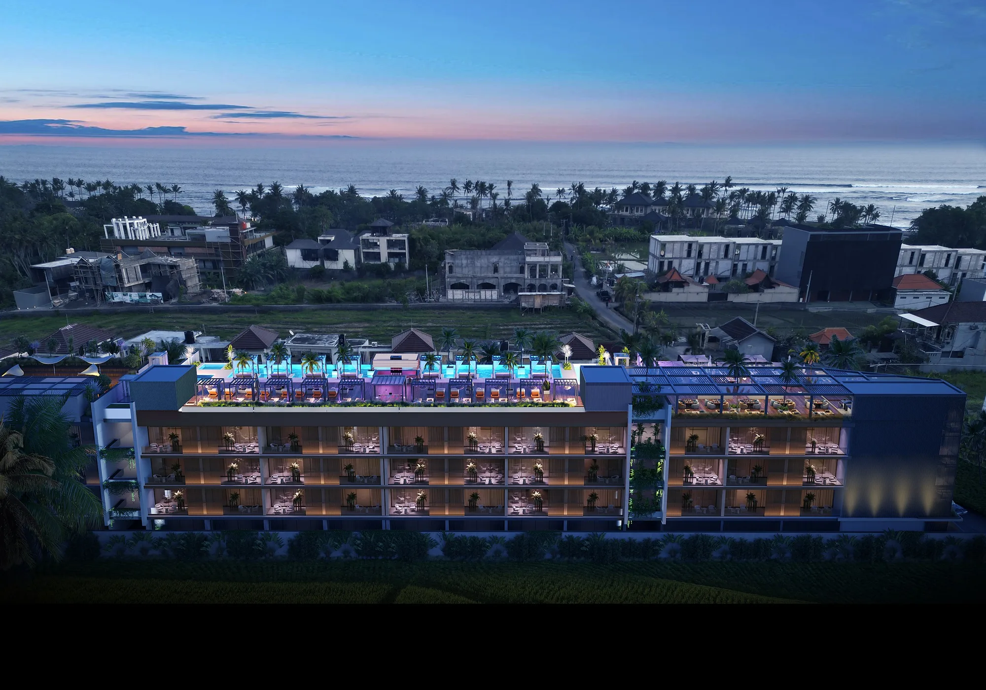 The Cemagi complex at night: lit terraces along the fields