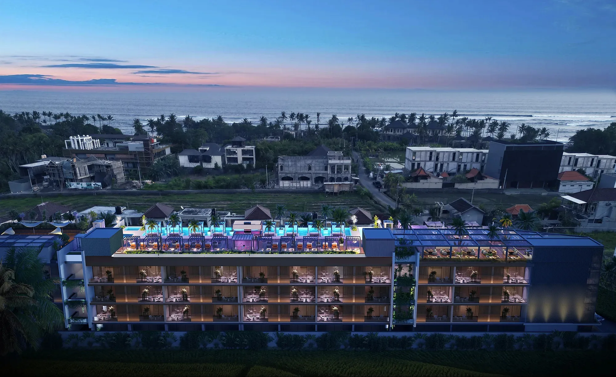 Cemagi Villas on Bali at night: lit terraces and the rooftop pool above the rice fields — SAD studio