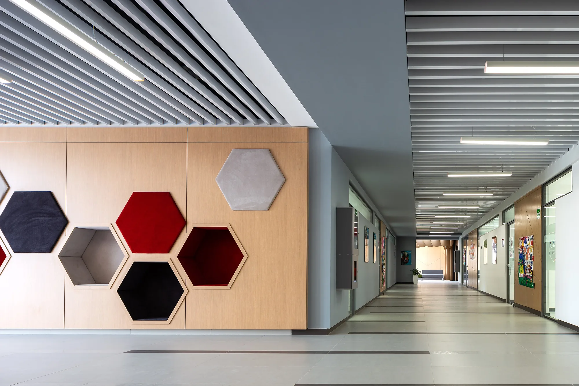 A corridor with honeycomb acoustic panels on the wall