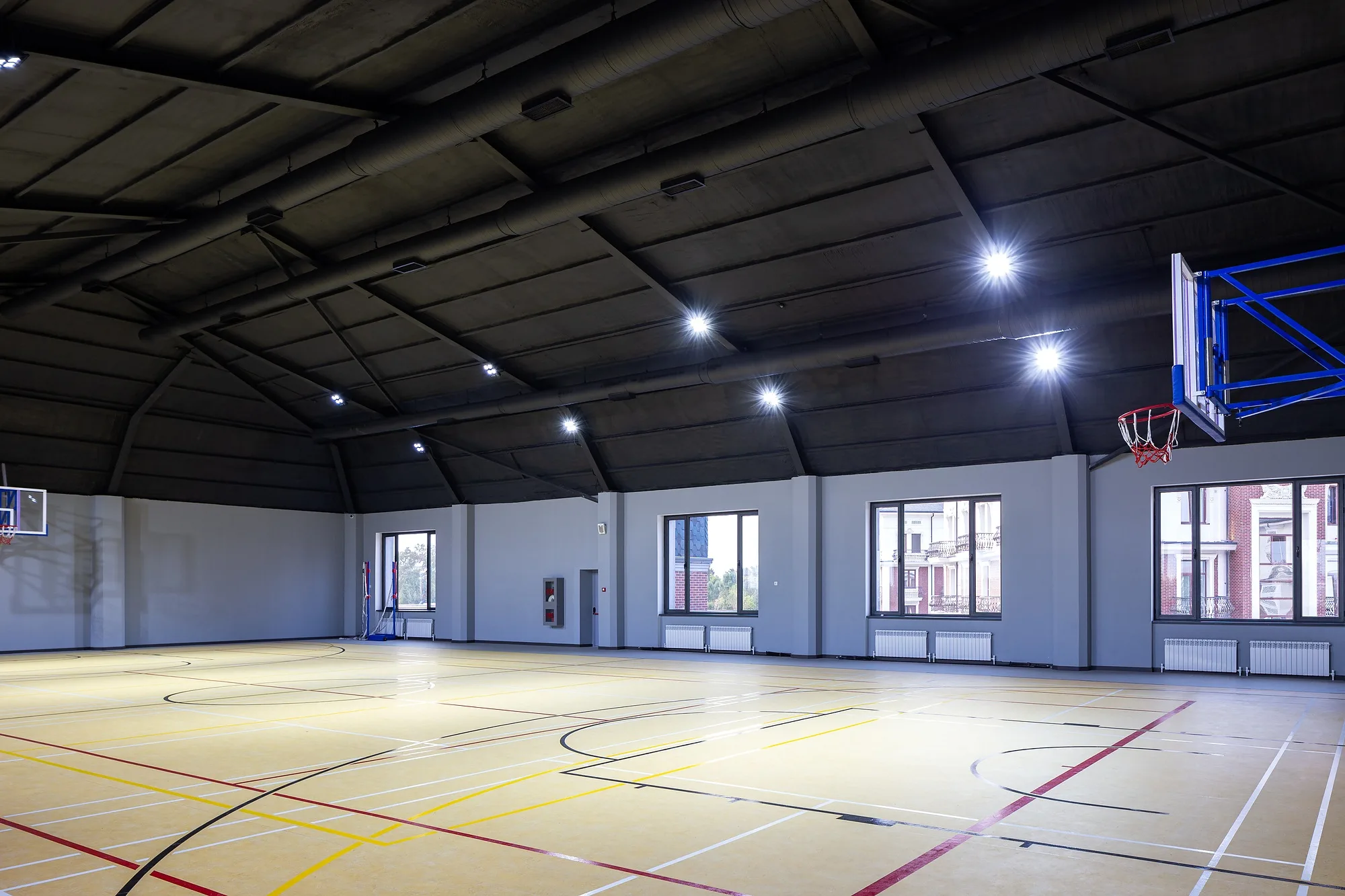The sports hall with court markings and rooflight