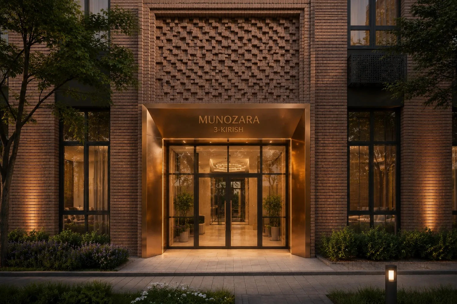 The entrance portal of a residential building in the Abdurauf Fitrat mahalla: textured brickwork lit in the evening