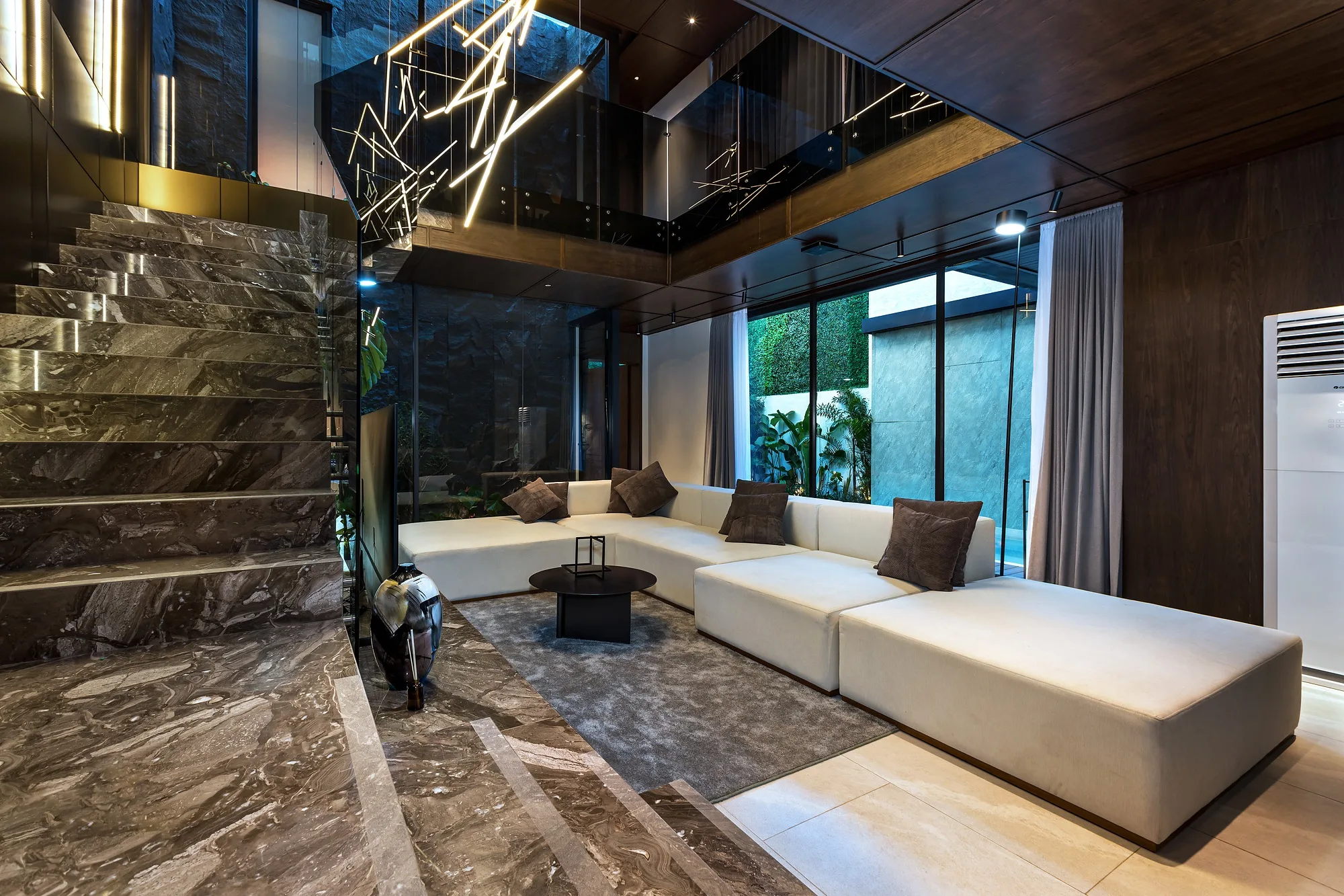 The kitchen in dark stone with lit niches