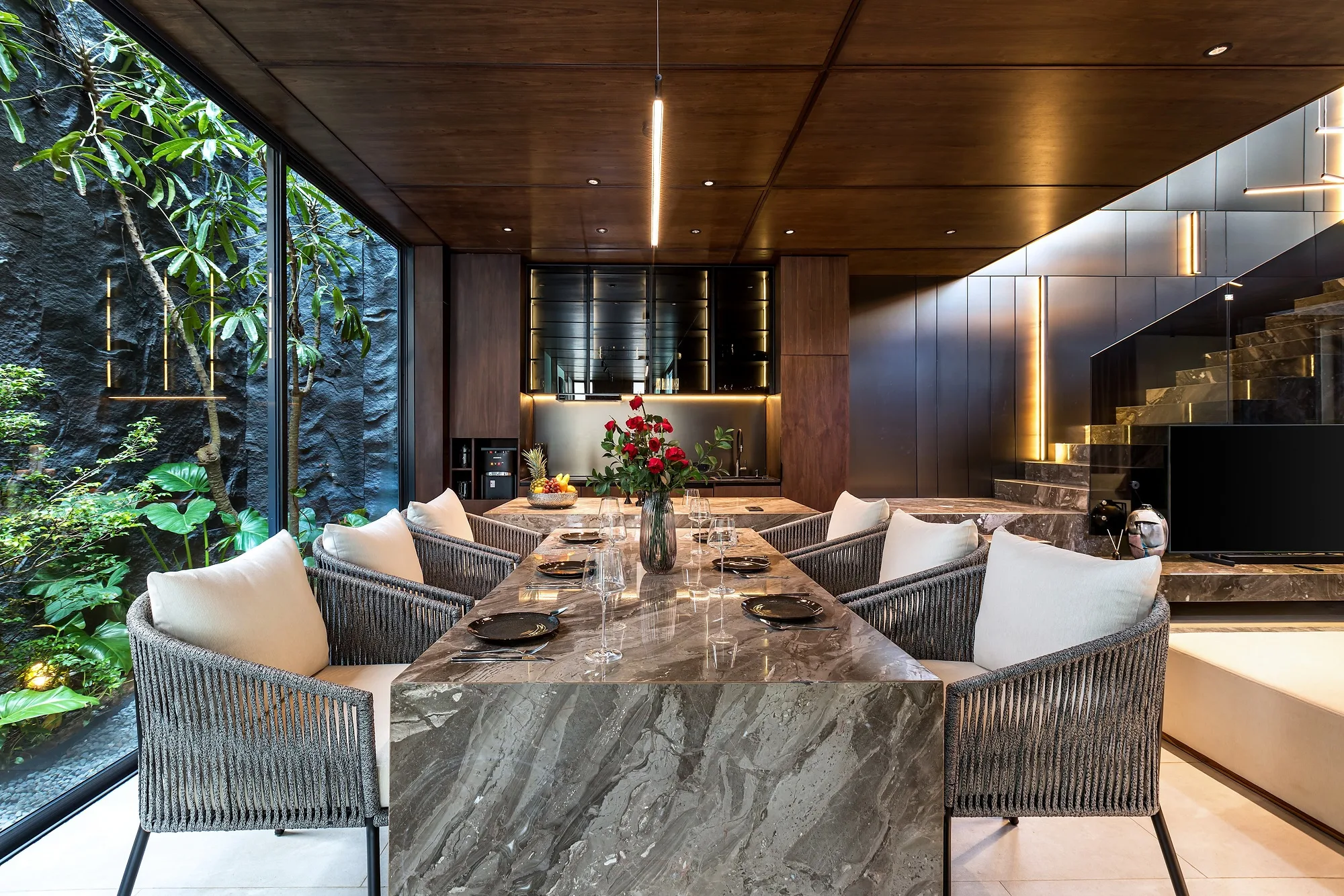 Villa living room: the seating area by the full-height glazing facing the courtyard