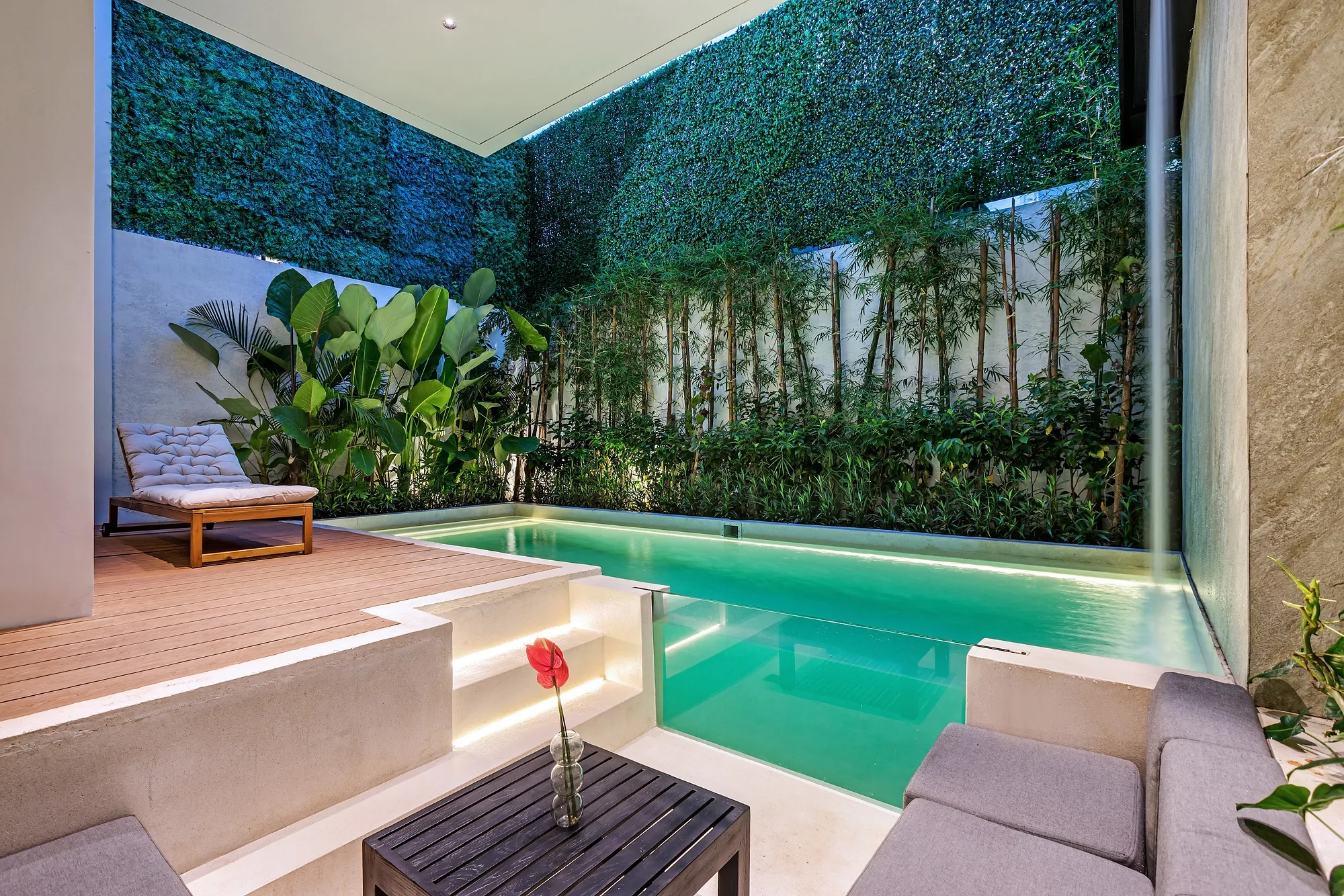 Courtyard of the two-bedroom villa: the pool along the deck and planting around the perimeter