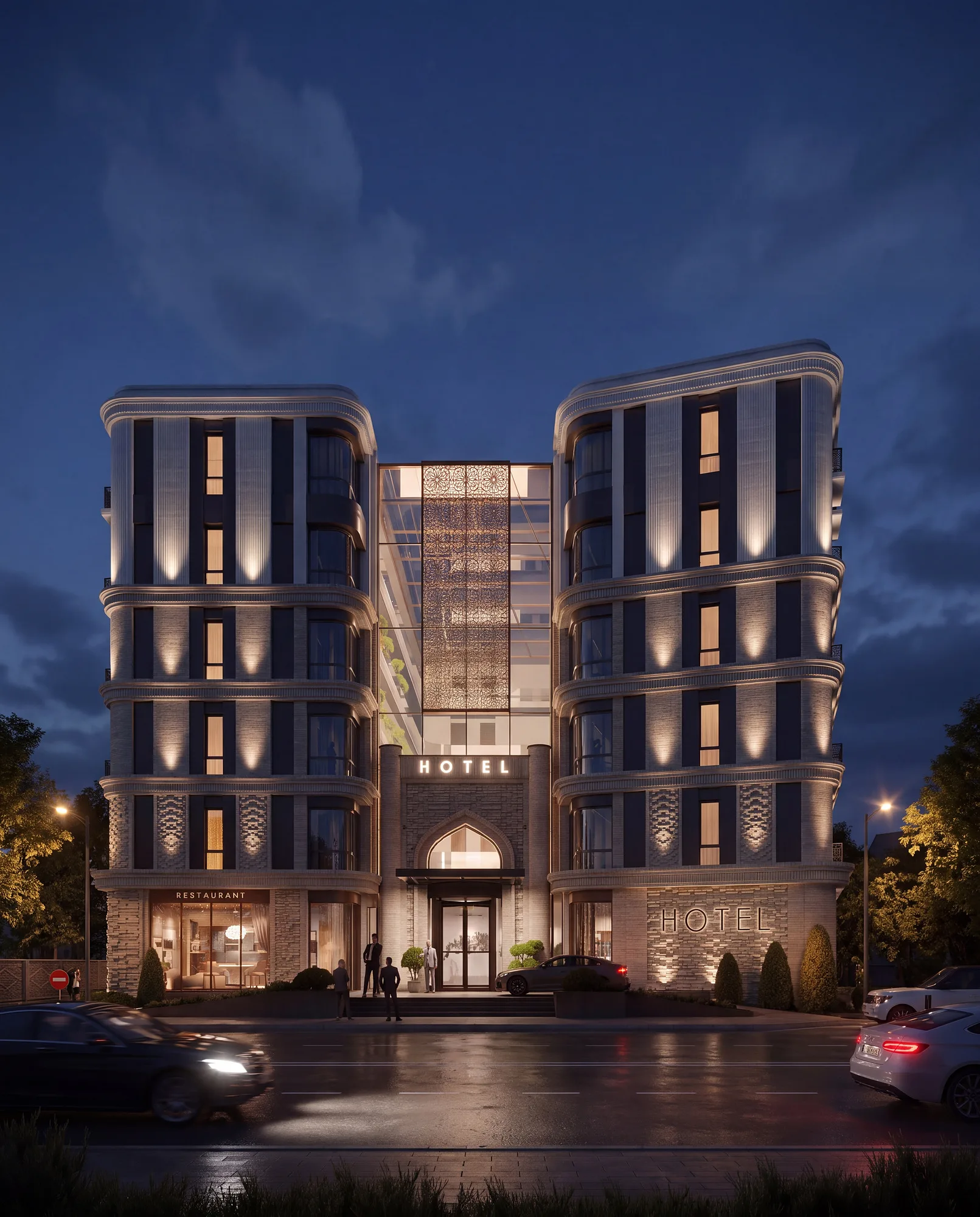 A hotel in Bukhara at night: two wings joined by a glazed volume and the lit entrance — SAD studio