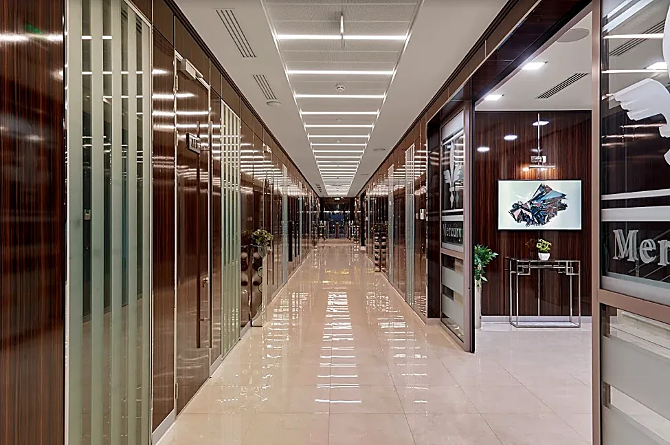An office-floor corridor with tenant frontages