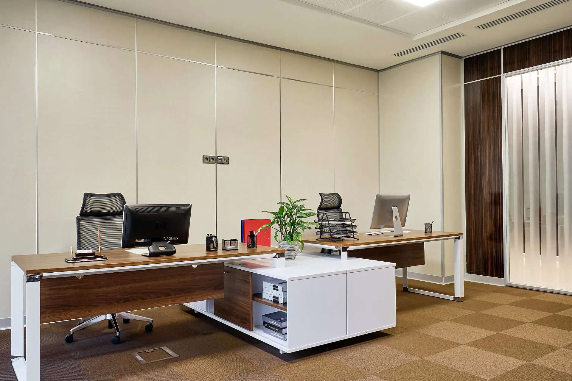 An open-plan office at the Mercury business centre: several workstations and low storage units