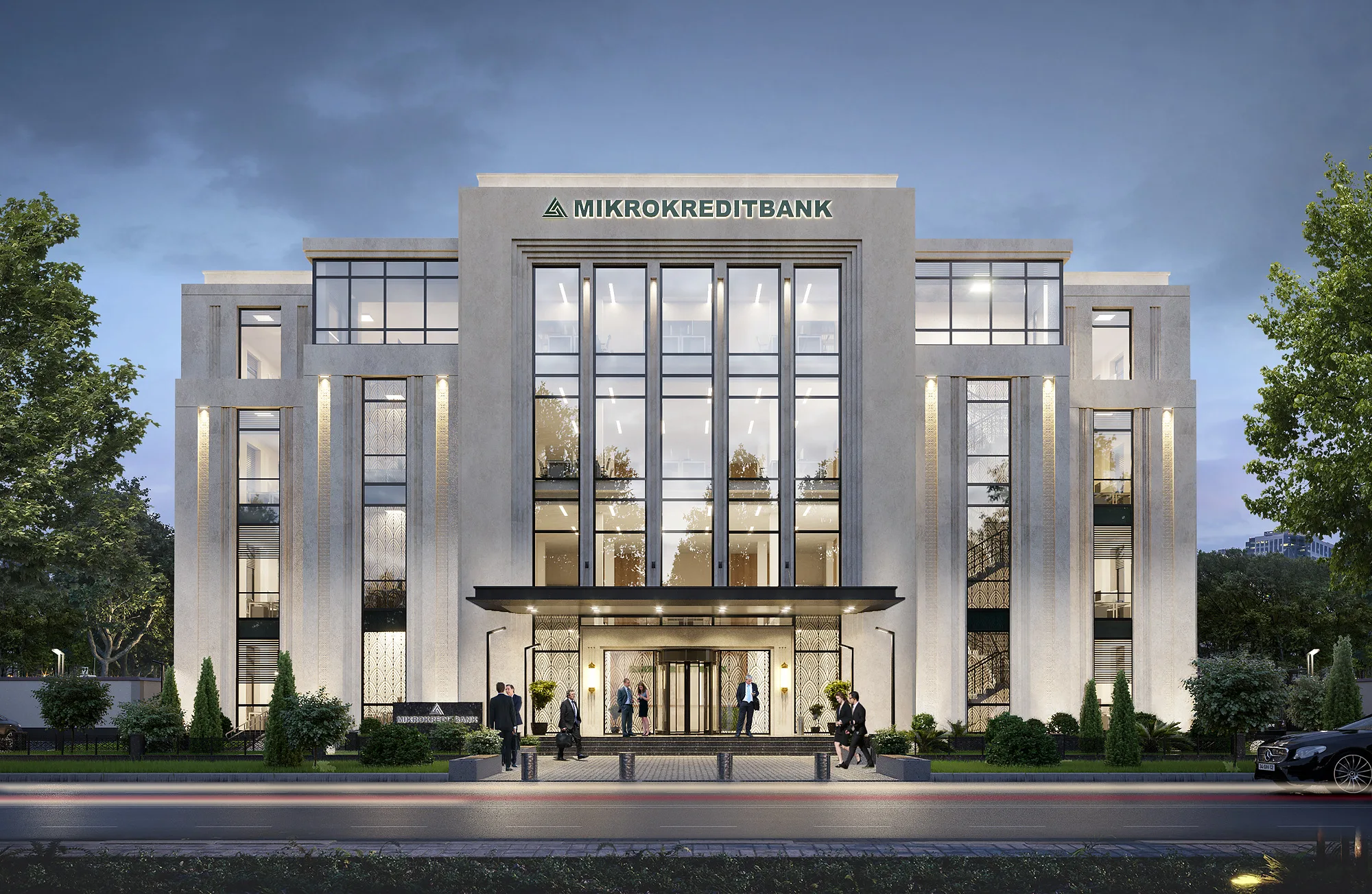 Mikrokreditbank in the evening head-on: the lit glazing of the banking hall and the signage on the cornice — SAD studio