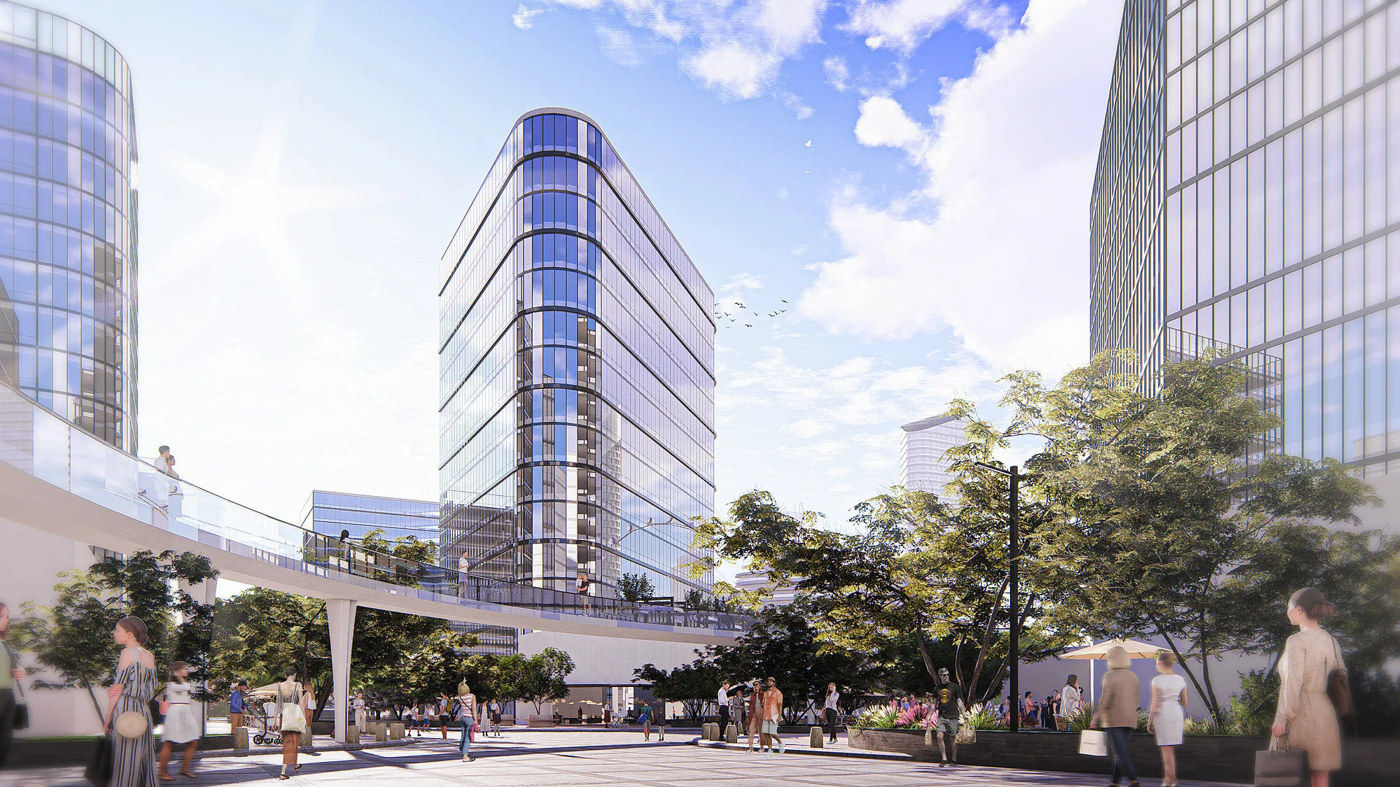 The office towers of the business core in the 80-hectare district: glazed facades and a terrace with pedestrians