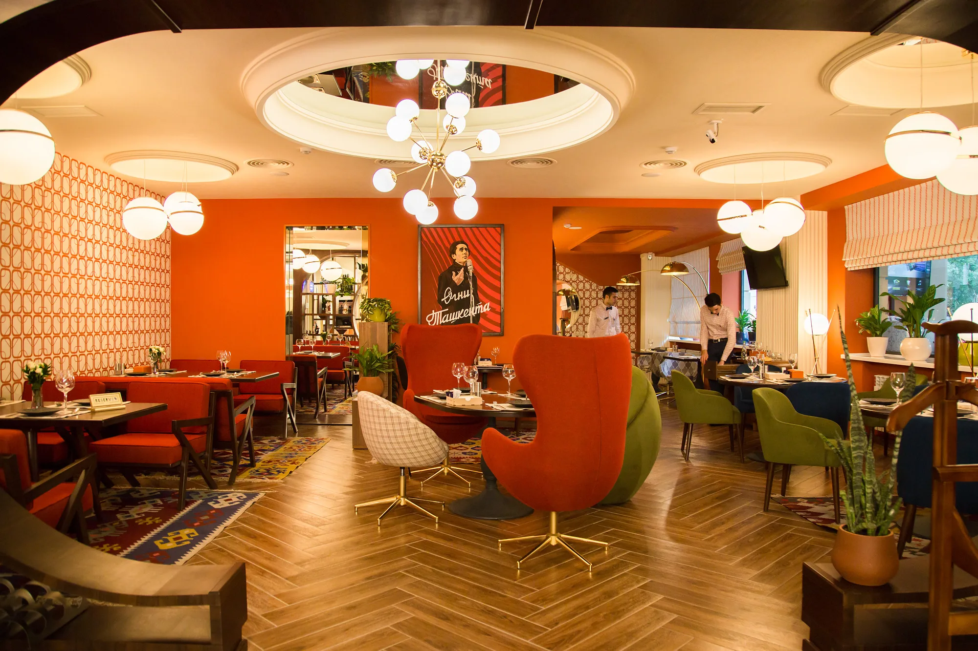 Ogni Tashkenta restaurant: the halls linked by arched openings, herringbone parquet and armchairs in Soviet retro — SAD studio