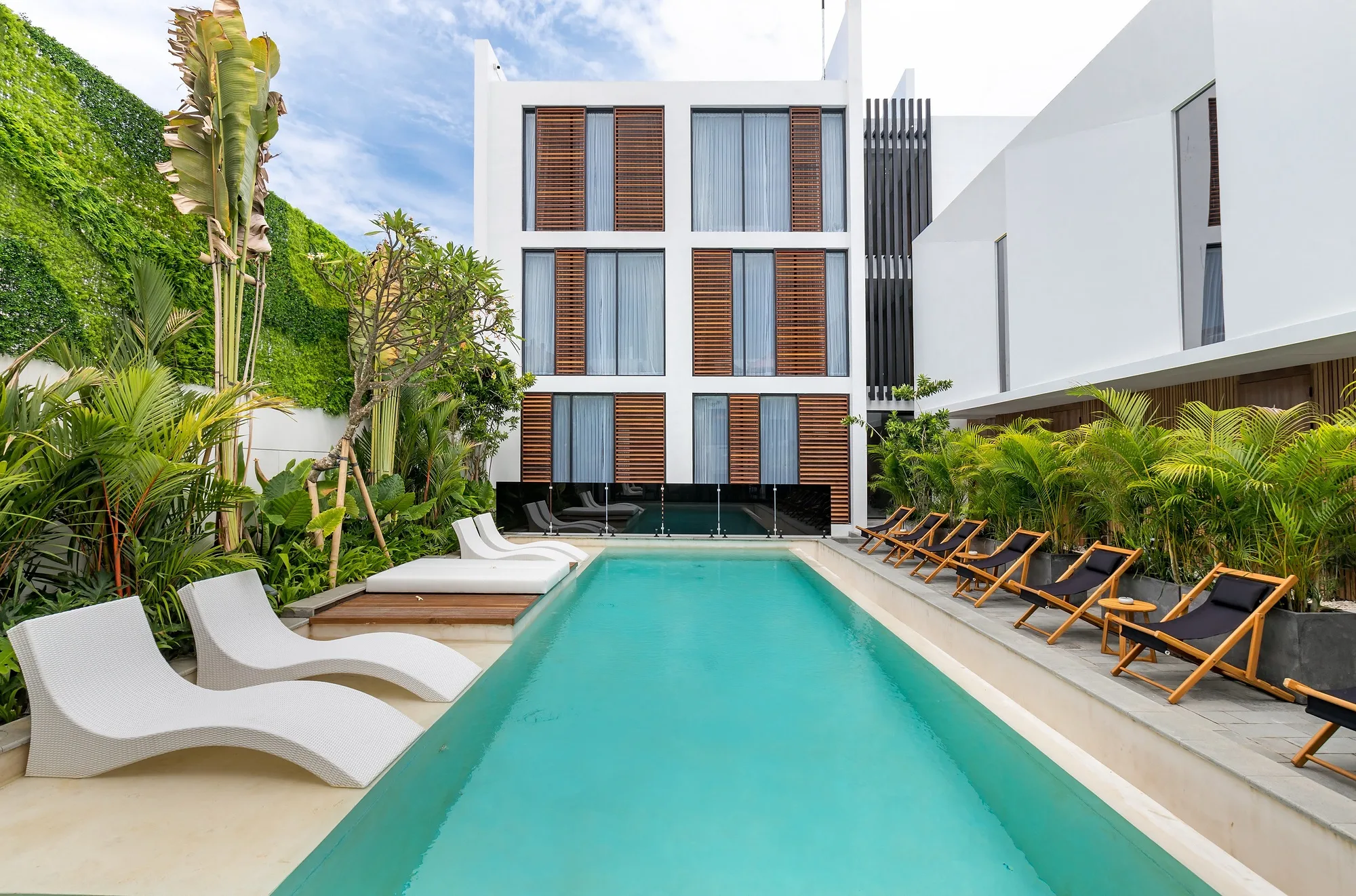 The Pererenan complex: the facade and the pool against the green slope