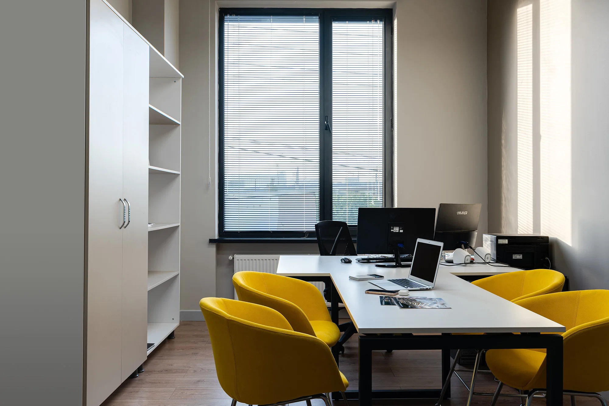 Manager office at Poytaxt Group in Tashkent: the desk, yellow armchairs and built-in storage — SAD studio