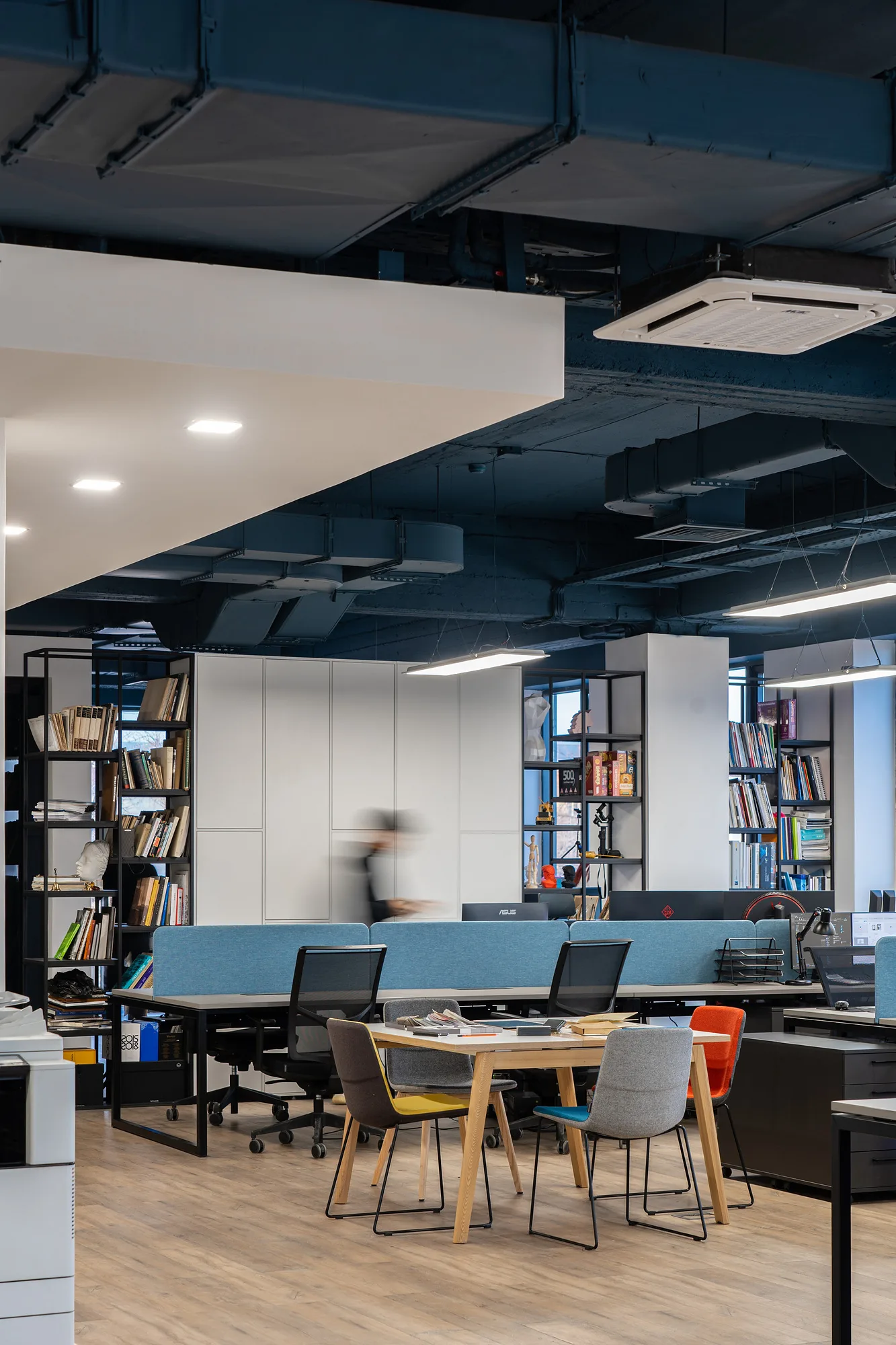 Work zone of SAD studio by the library: collaboration tables and shelves with material samples — SAD studio