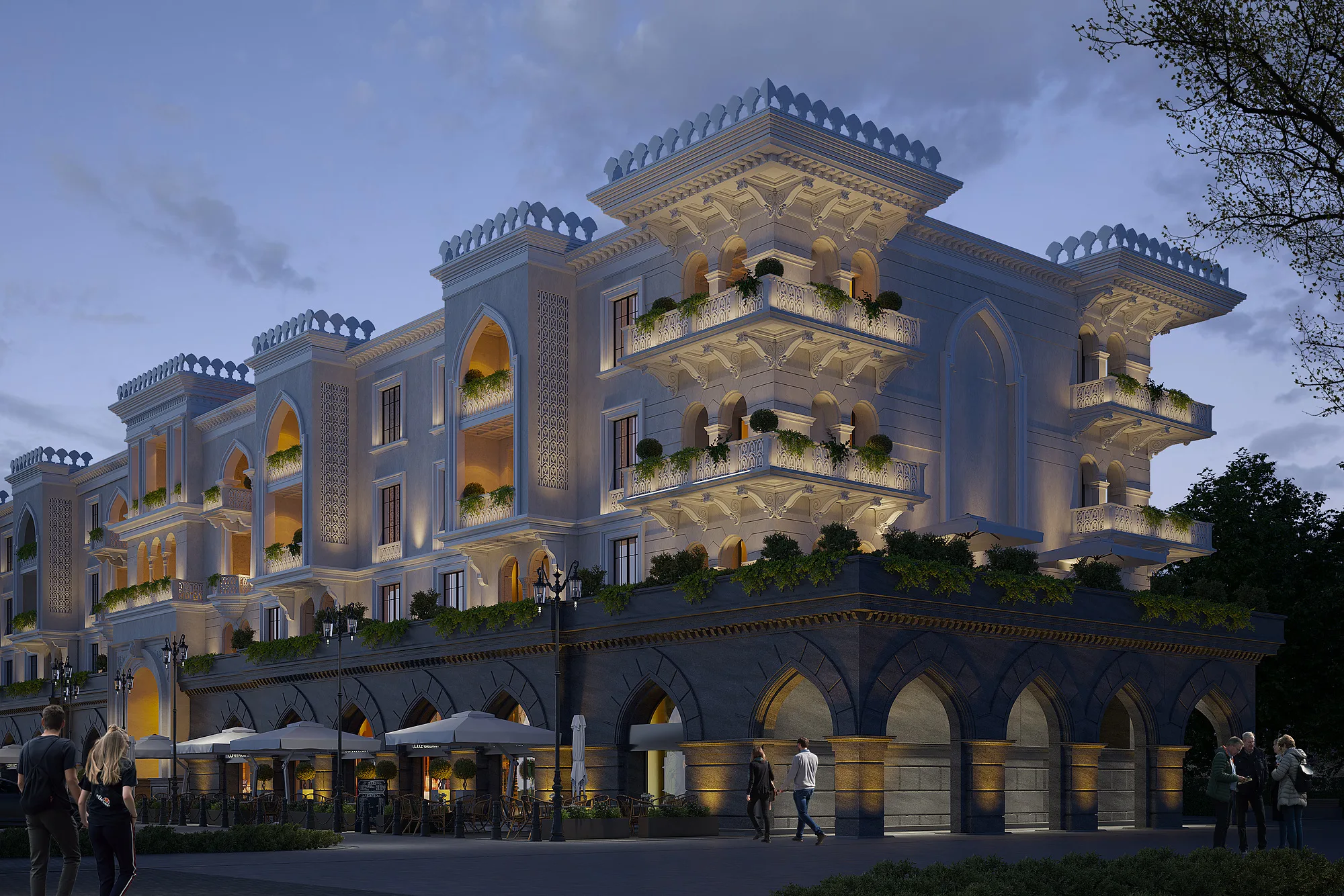 Sheron apartments in the evening: lit arcades and upper-floor terraces