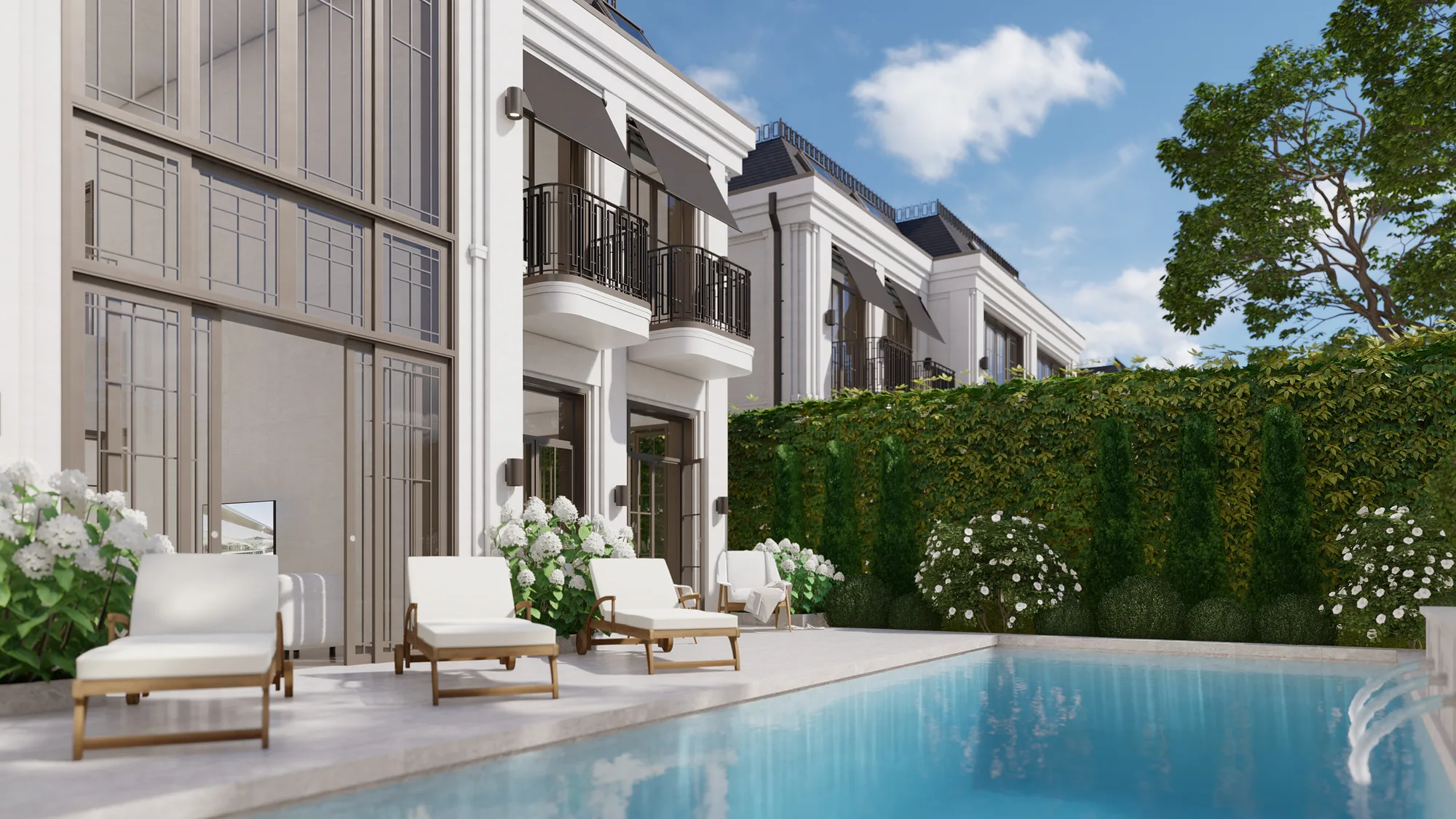 A pool terrace at a Sheron villa: a lounge area between the wings