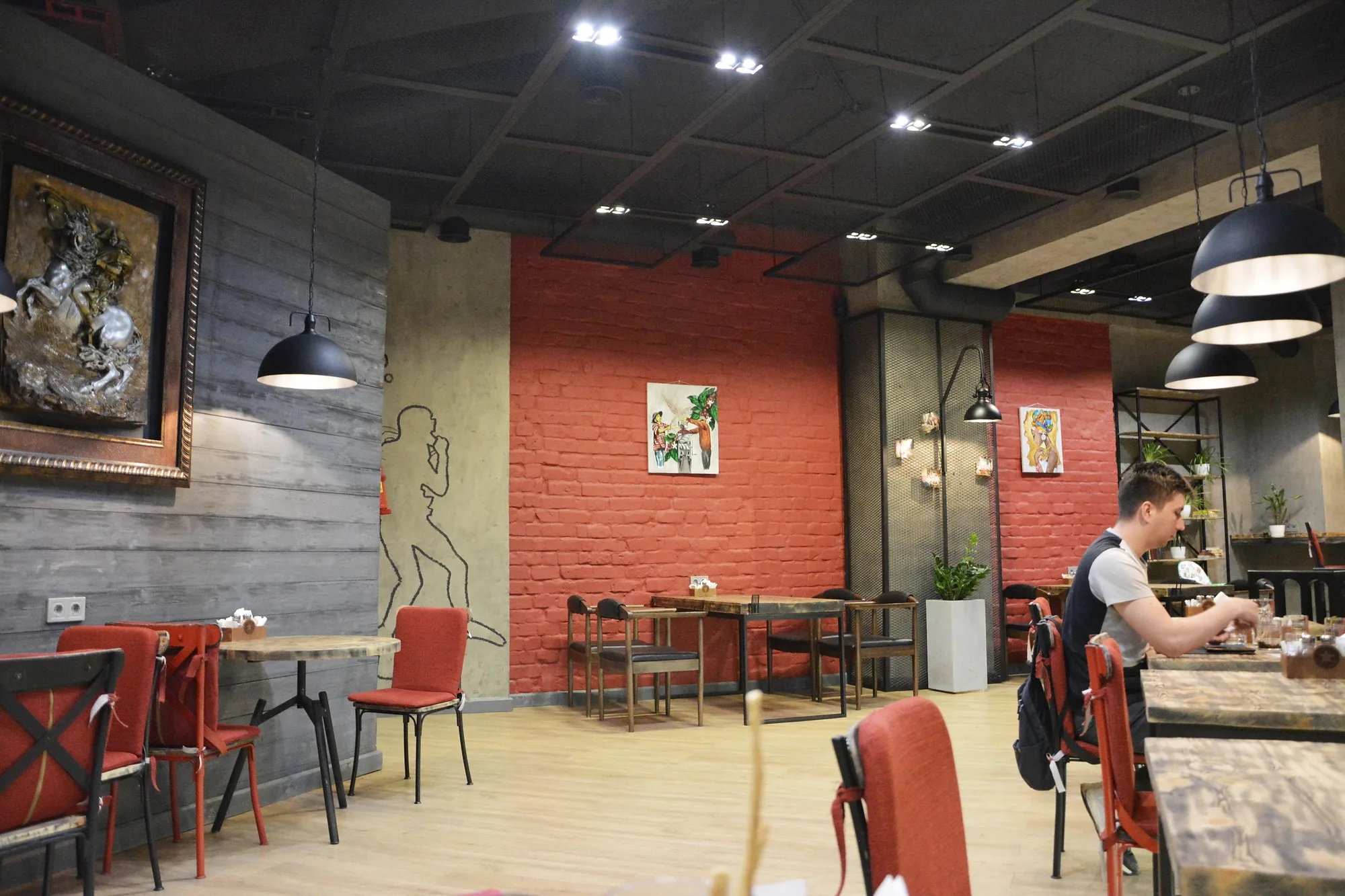 TIM'S Coffee & Roastery in Tashkent: the hall with a red brick wall — SAD studio