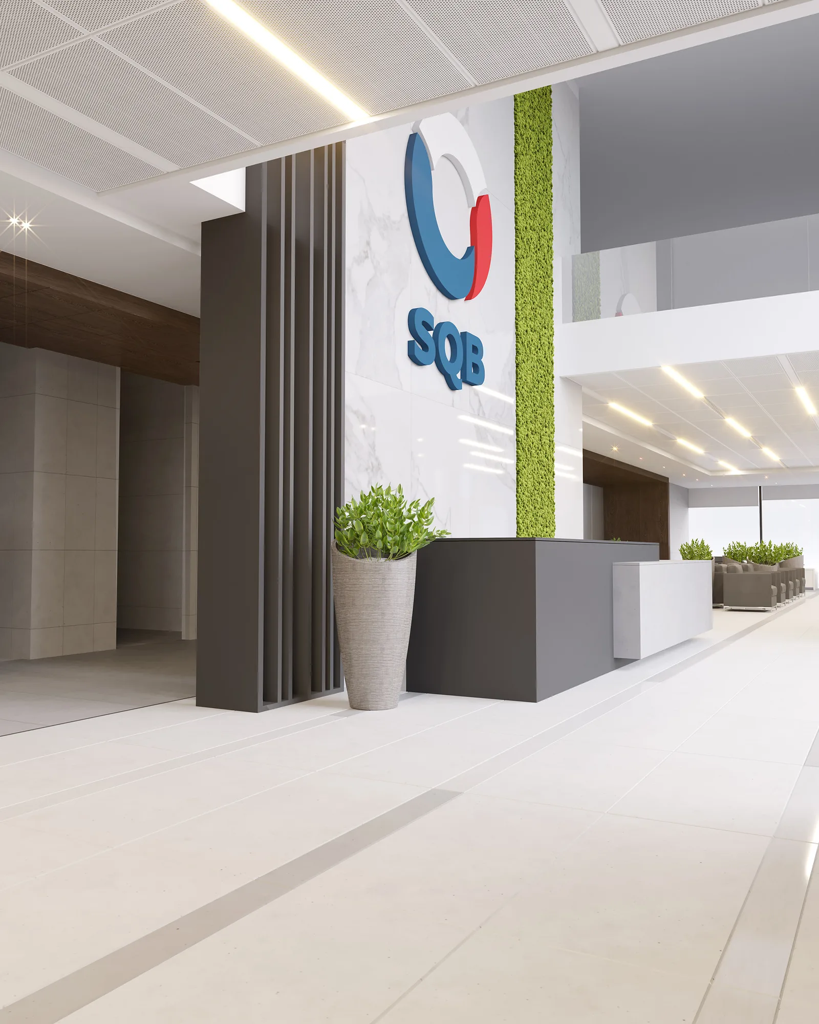 The SQB logo in the Uzpromstroybank branch in Nurafshan: the mark on marble next to a green wall — SAD studio